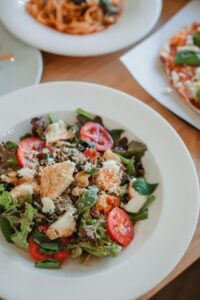 Delicious salad in plate on table 